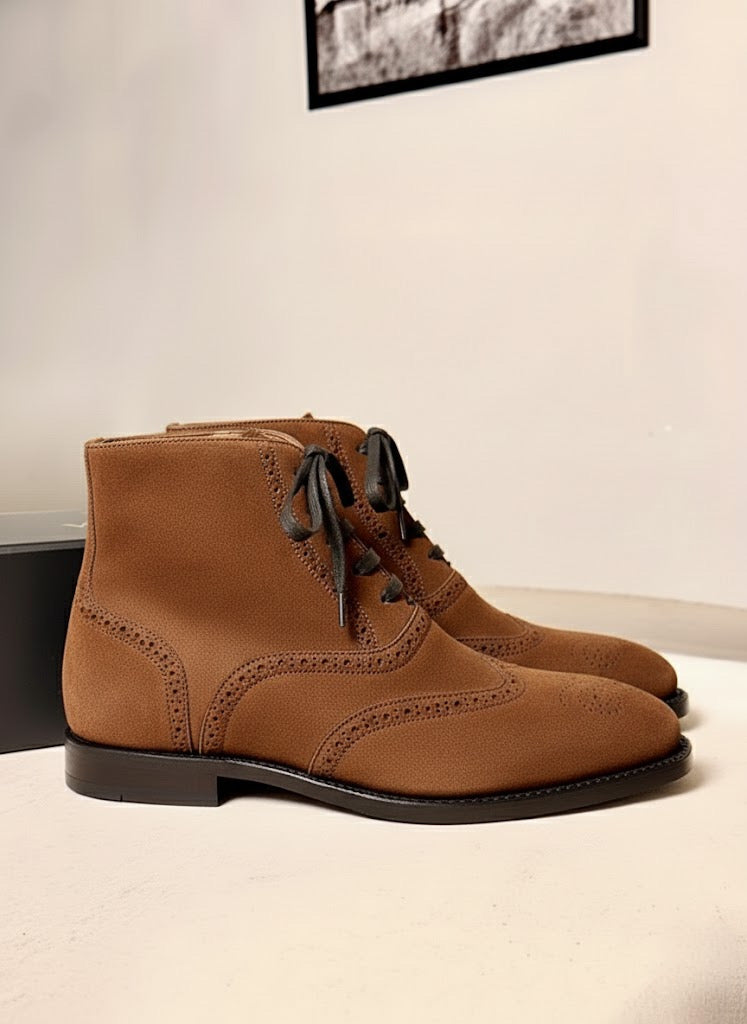 Saddle brown wingtip suede boots