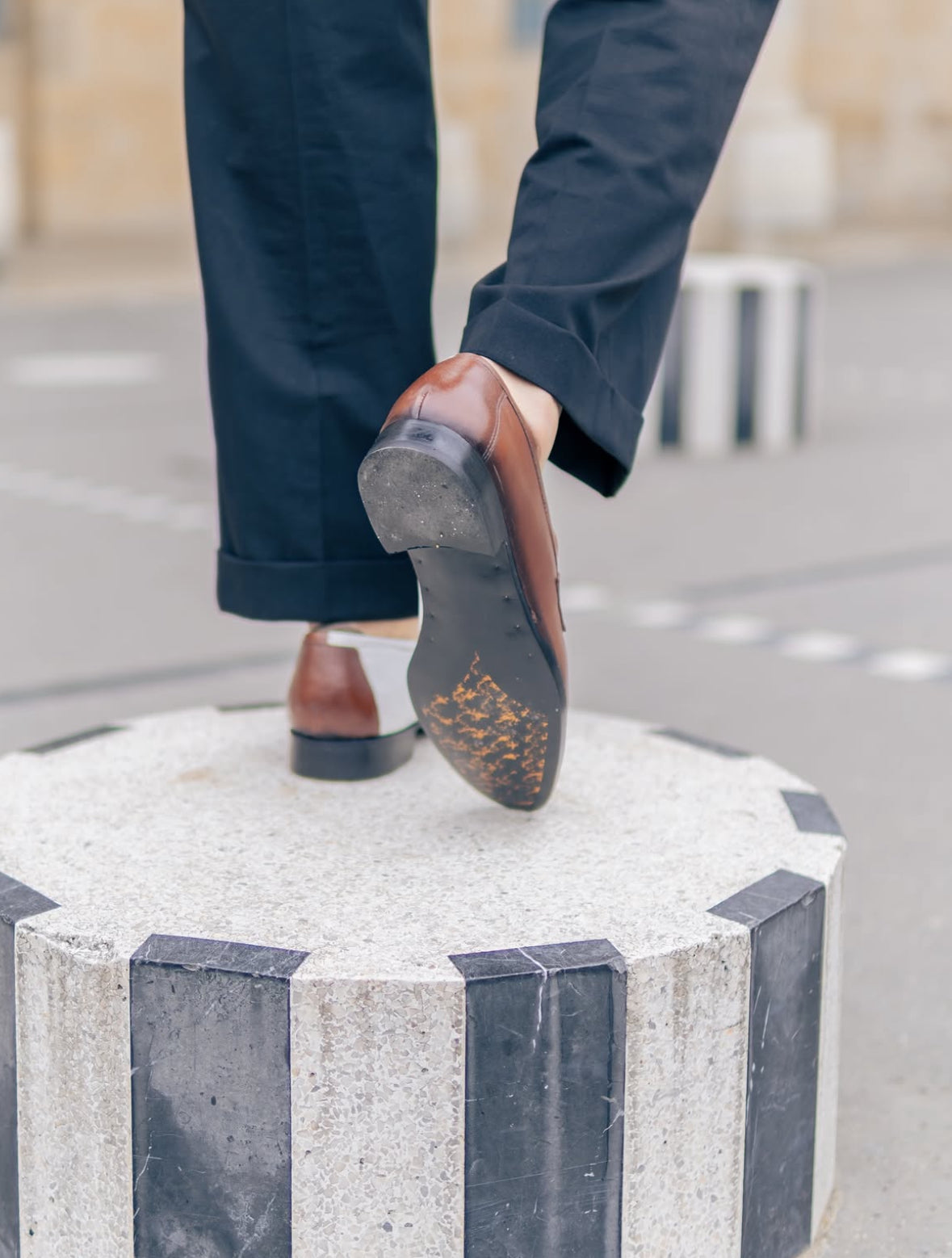 Brown and white penny loafers