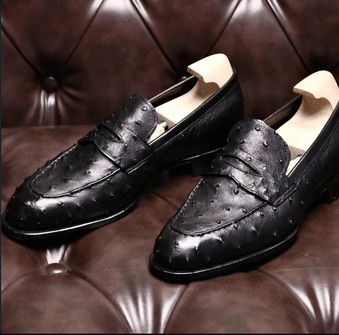 Black ostrich skin penny loafers