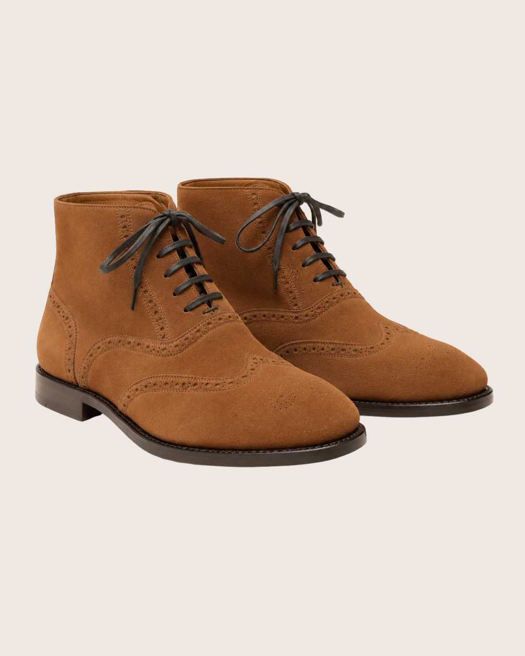 Saddle brown wingtip suede boots