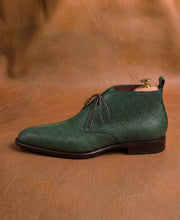 Pearl running along the vamp of a men's green stingray derby boot