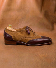 Boundary where the suede panel meets the smooth calf