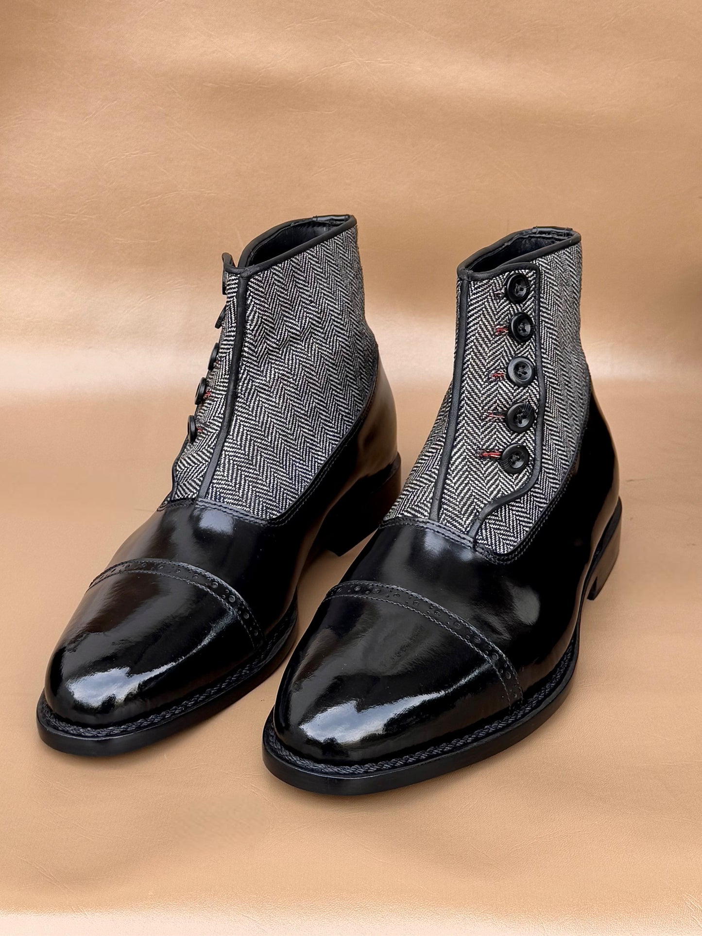 Black norwegian stitch button boots