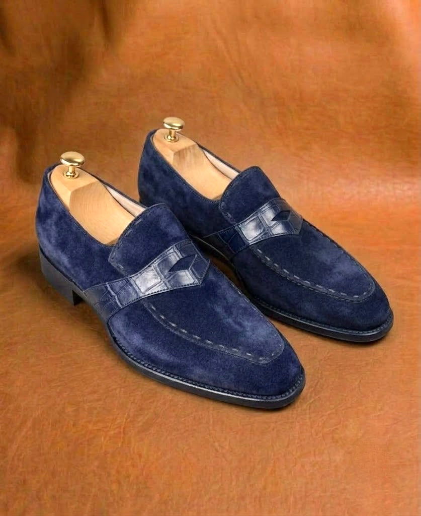 Men's blue suede penny loafers, three-quarter view