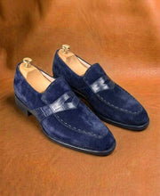 Men's blue suede penny loafers, three-quarter view