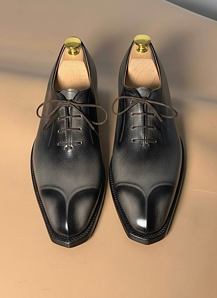 Smoked gray oxford, side profile showing gradient from vamp to welt