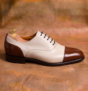 Two-tone cap-toe Oxford shoes