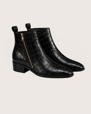 genuine crocodile leather scales close up black boot
