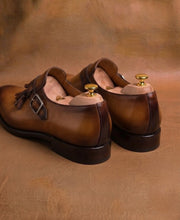 Pair of men's tan and brown tassel monk strap shoes, made to order