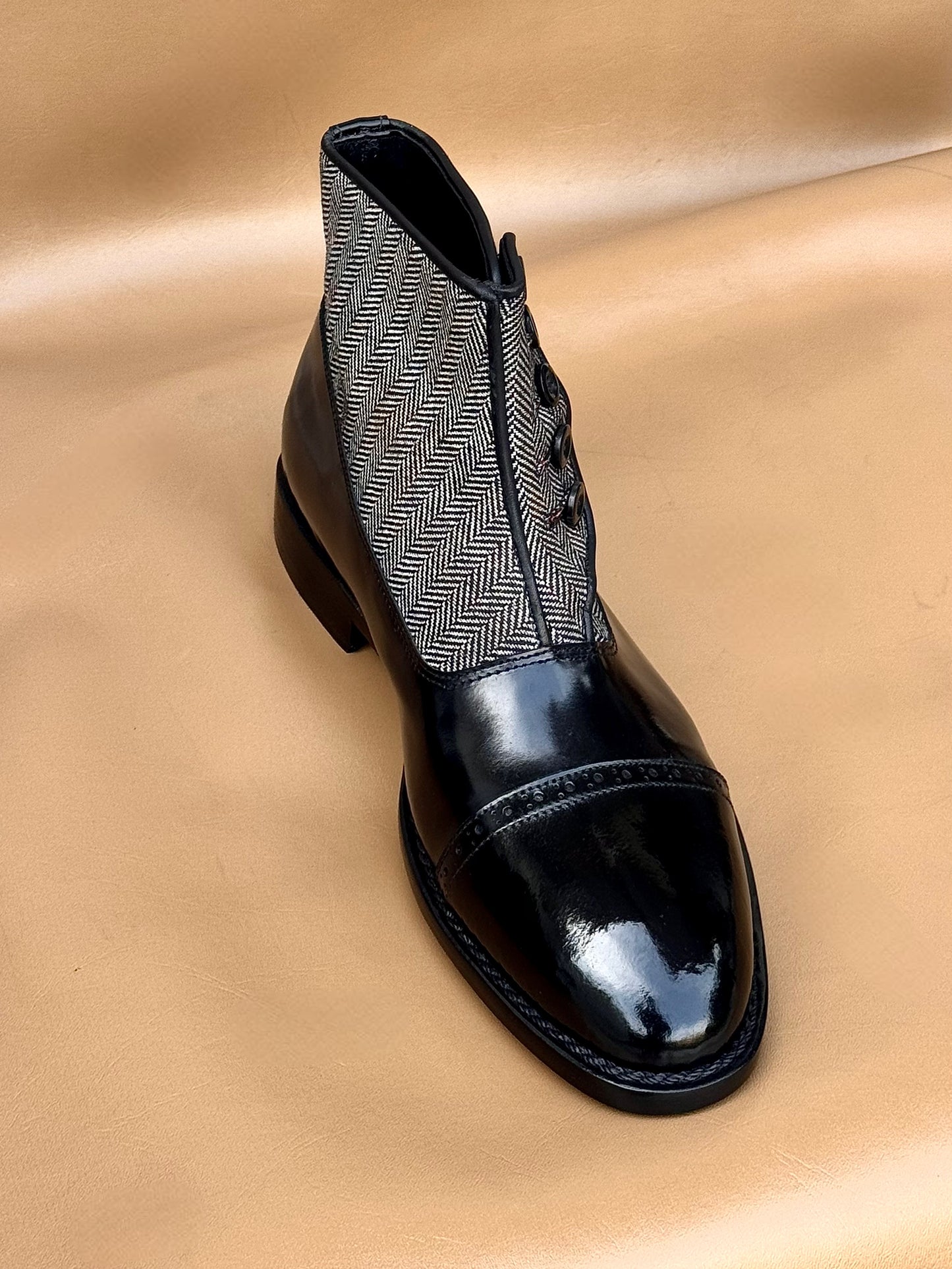 Black norwegian stitch button boots