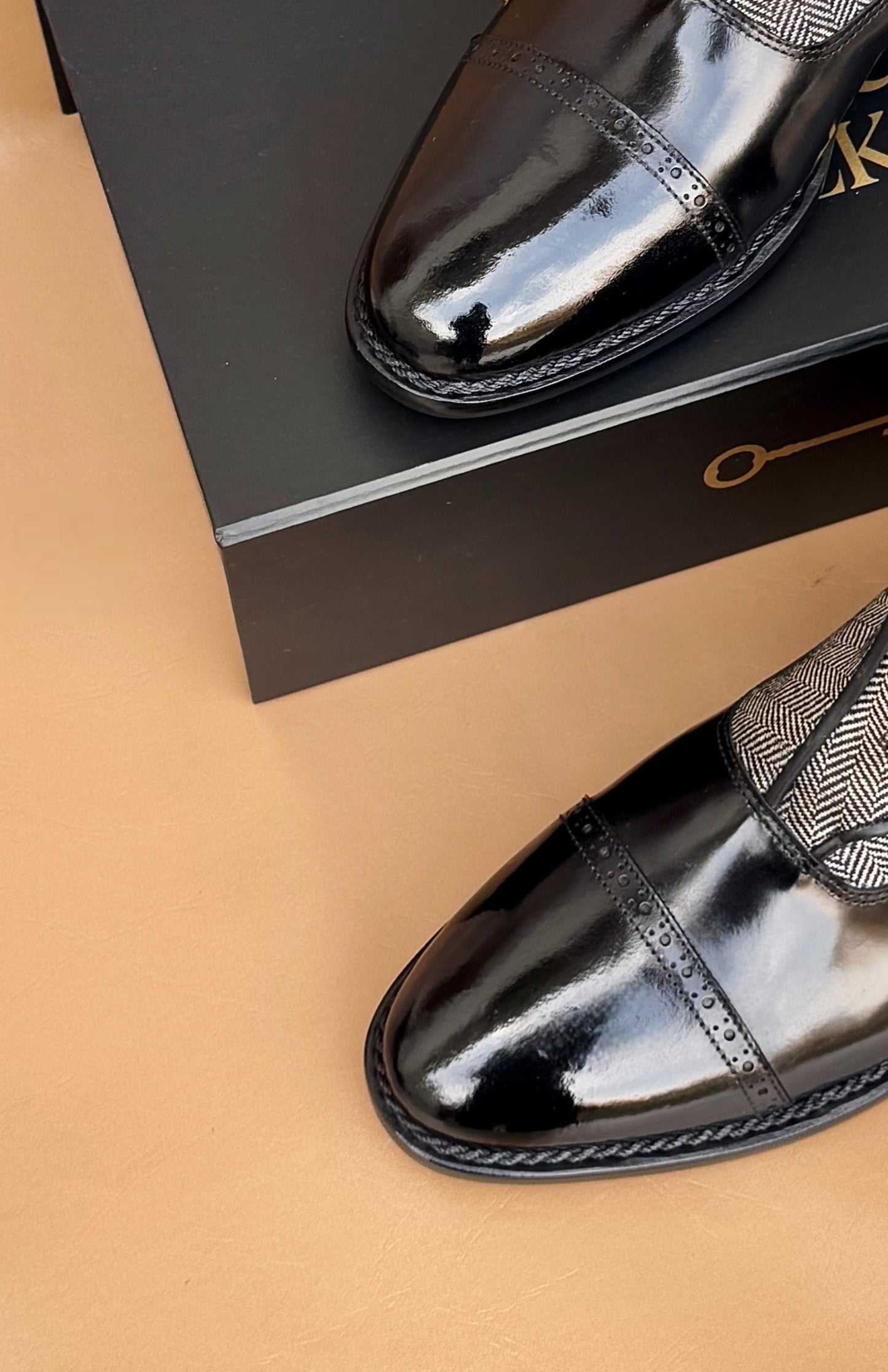 Black norwegian stitch button boots
