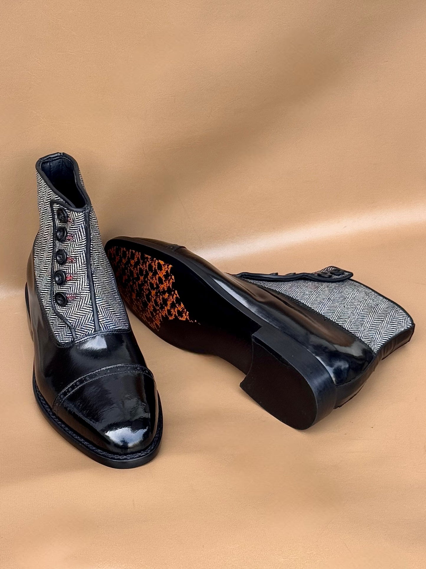 Black norwegian stitch button boots