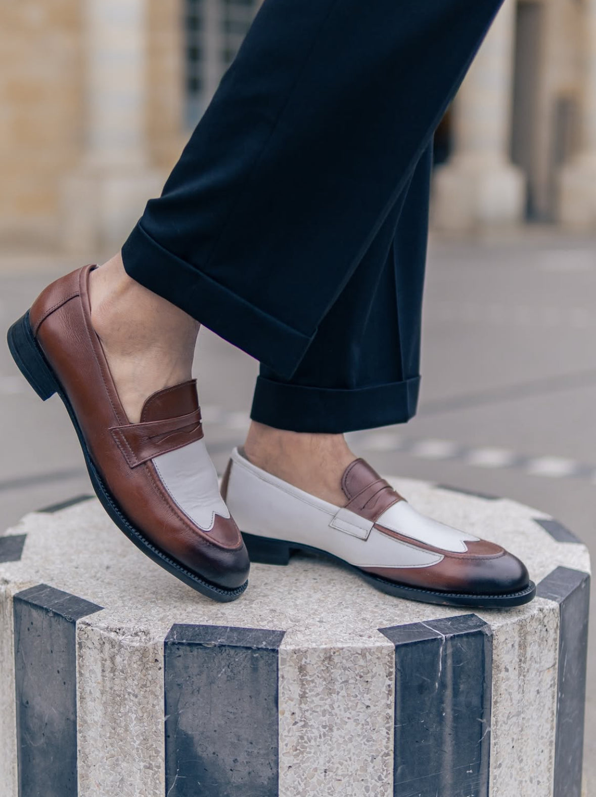 Brown and white penny loafers