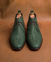 Side profile of green stingray derby boot with hand welted leather sole