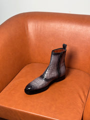 Gray and black patina boots