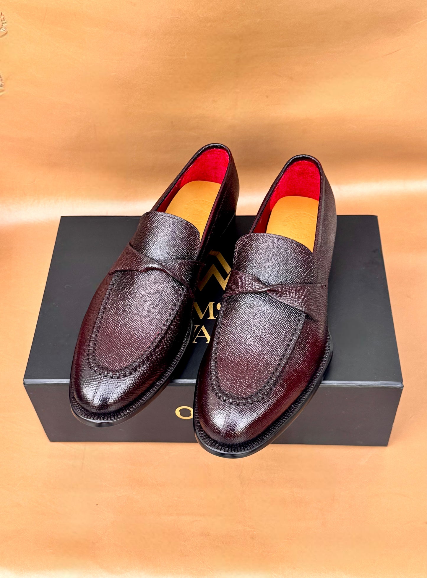 Brown twist strap loafers