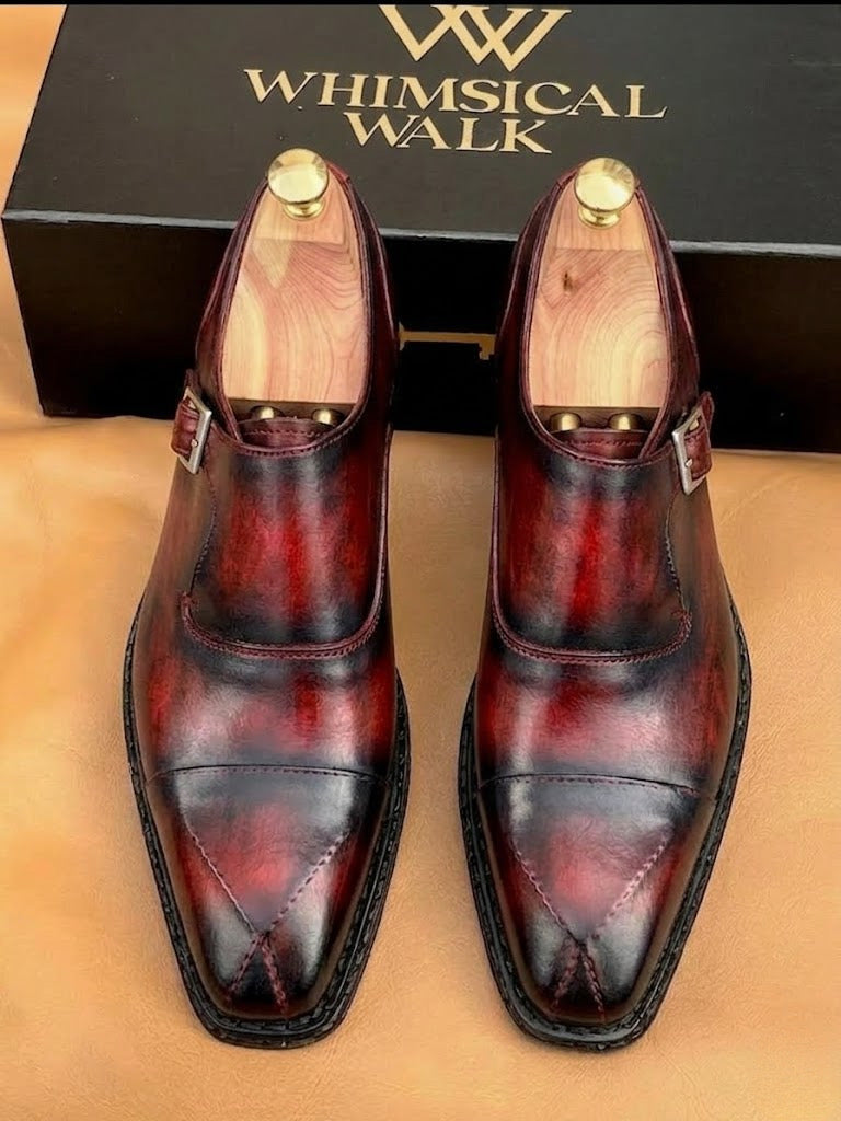 Red patina monk strap shoes for men, three quarter view