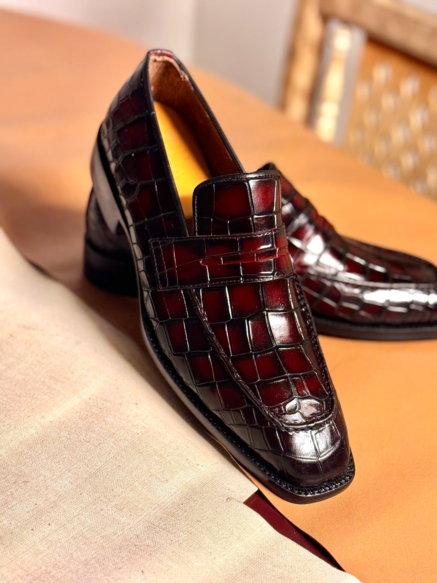 Red crocodile penny loafers