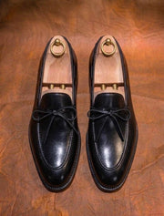 Black bow loafers