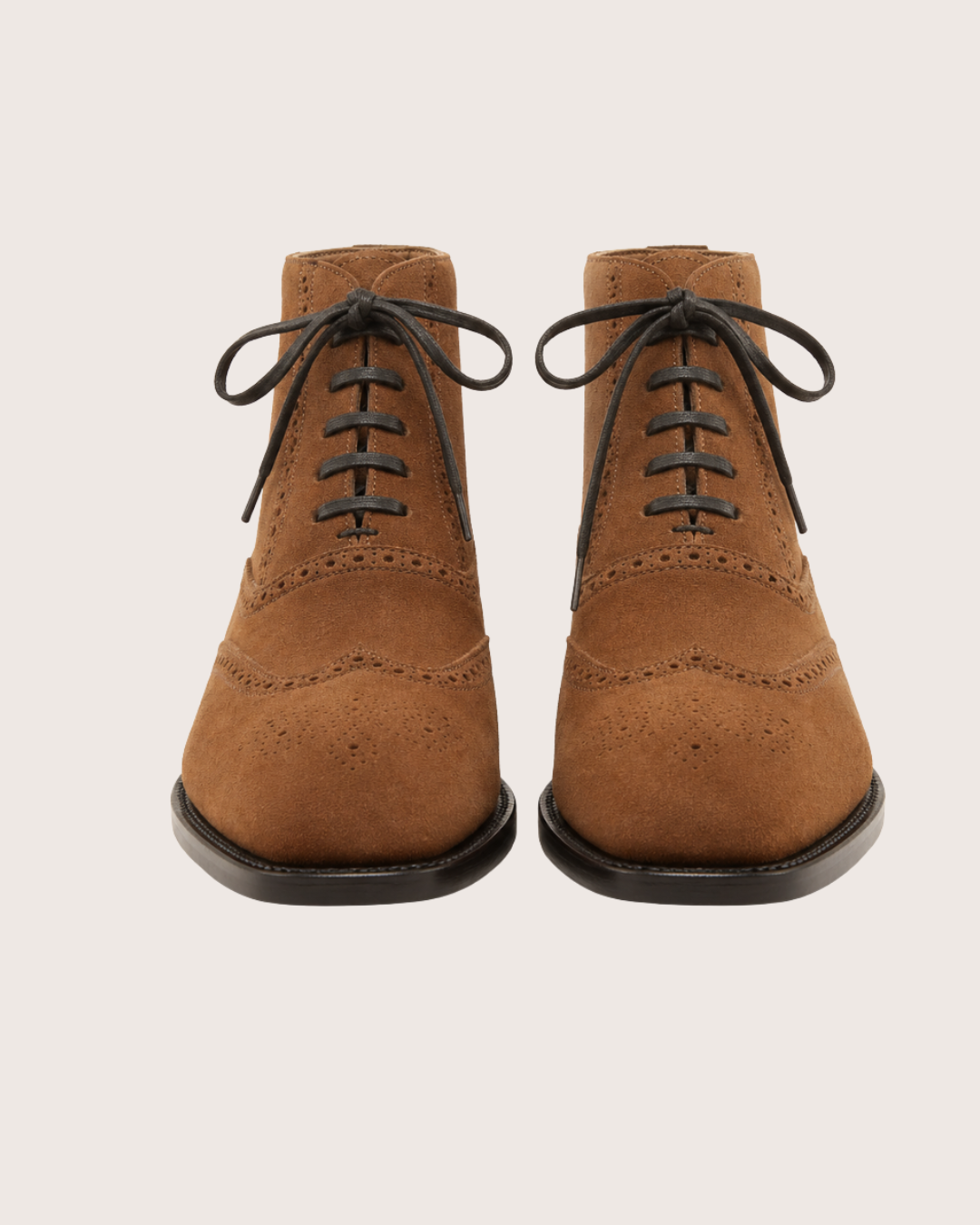 Saddle brown wingtip suede boots