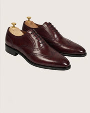 burgundy brogue detailing medallion toe close up
