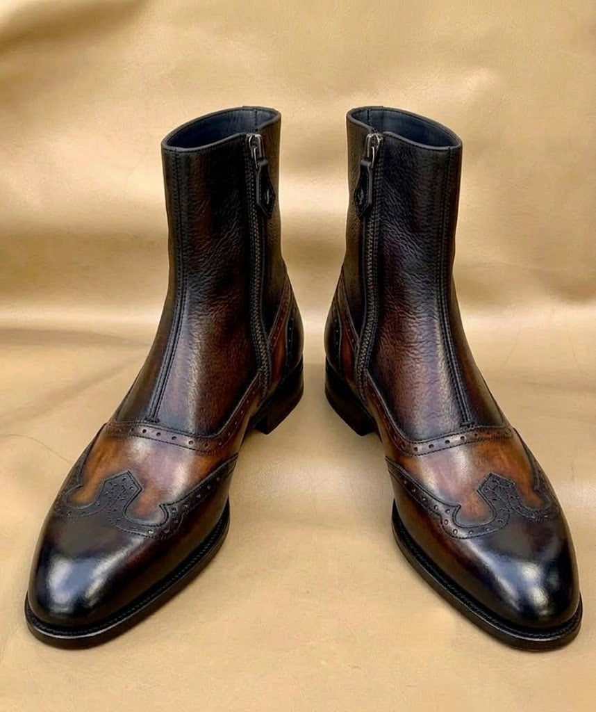 Side zip closure and pull on a brown leather boot