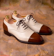 Two-tone cap-toe Oxford shoes