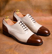 Two-tone cap-toe Oxford shoes