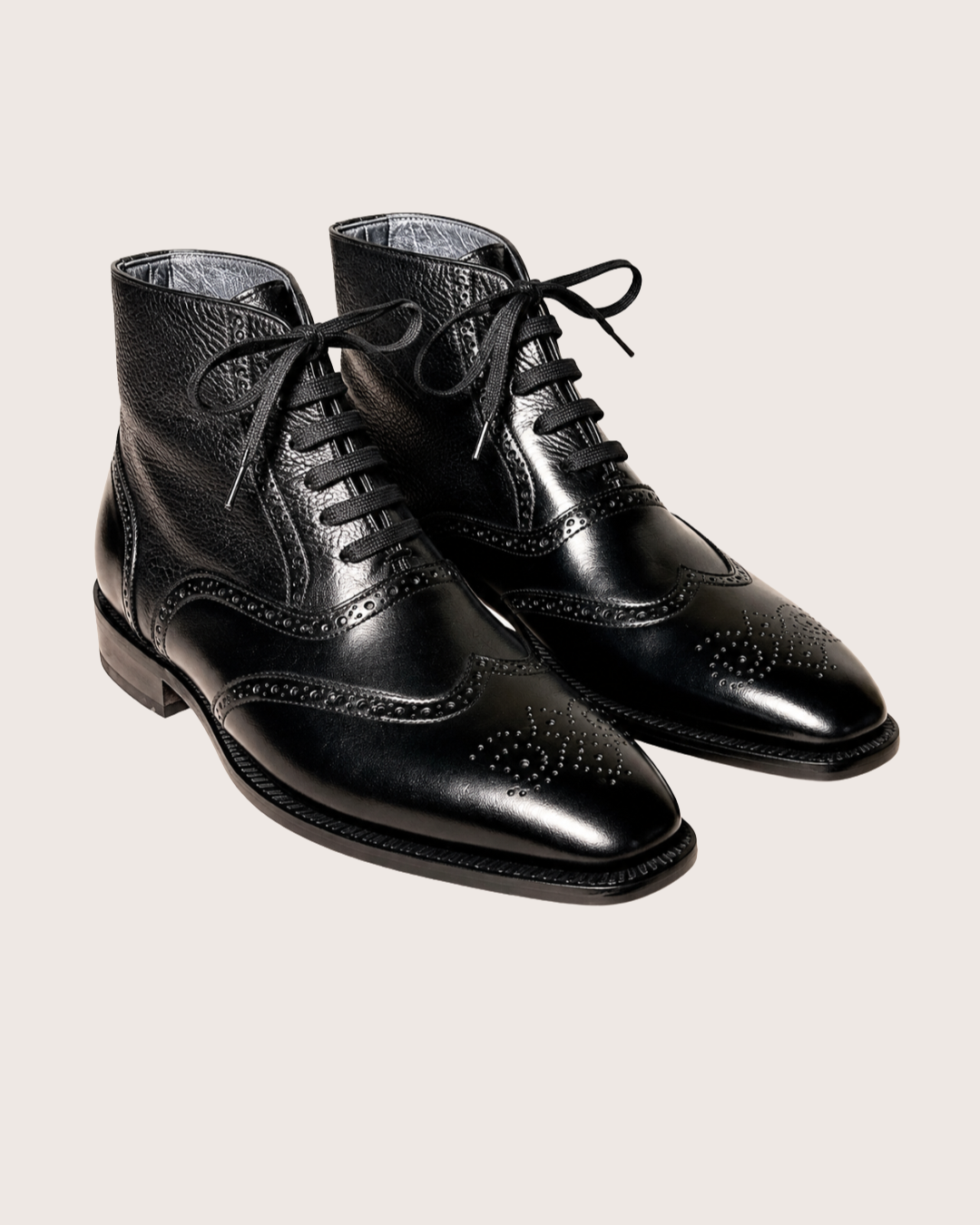 Black wingtip boots