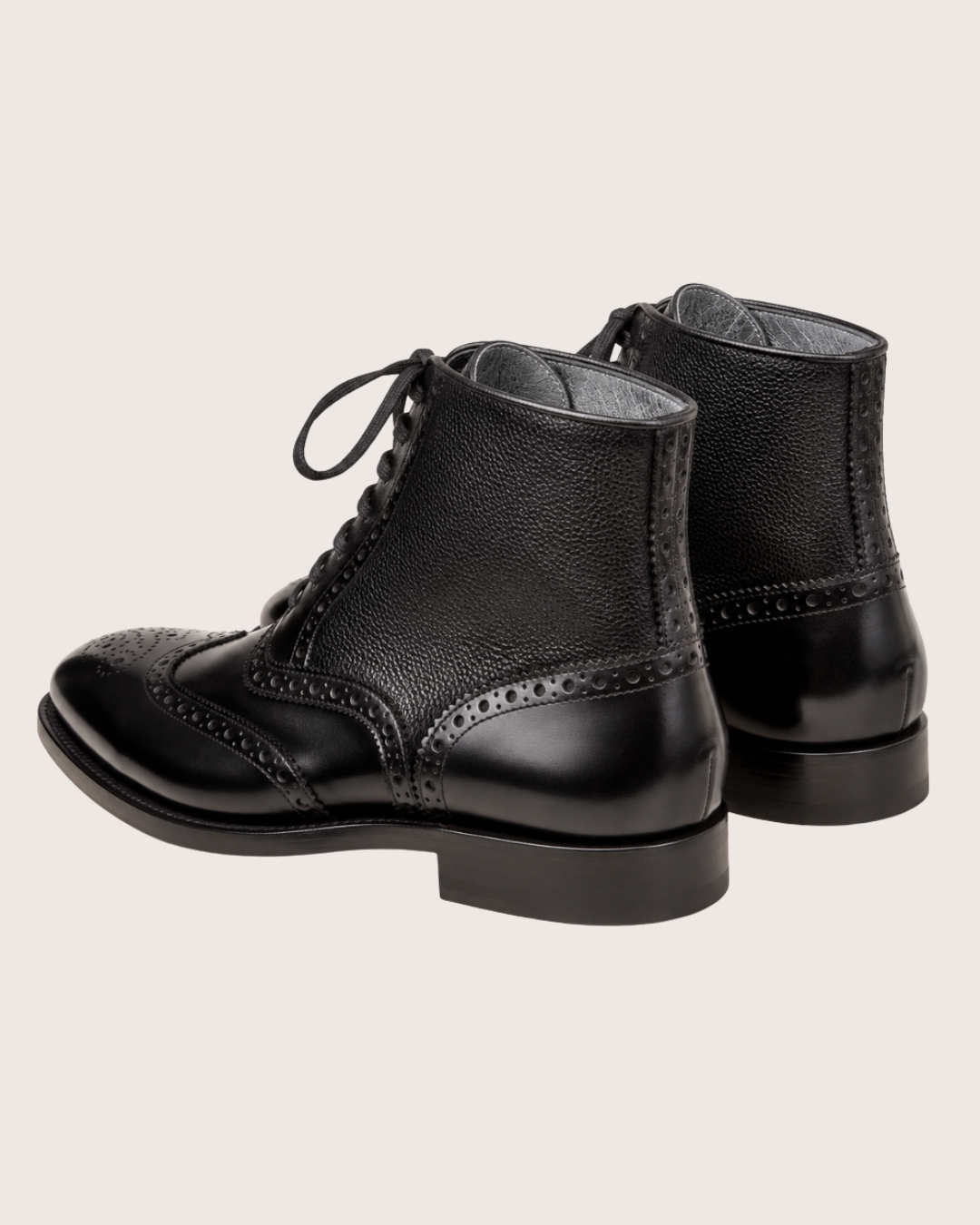 Black wingtip boots