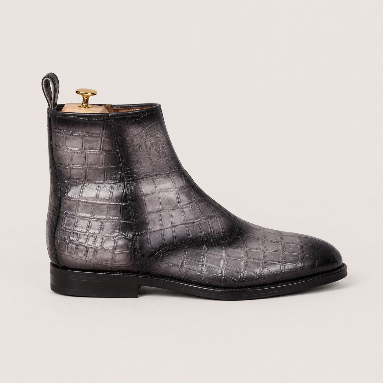 Gray and black patina boots