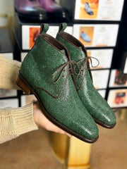 Side profile of green stingray derby boot with hand welted leather sole