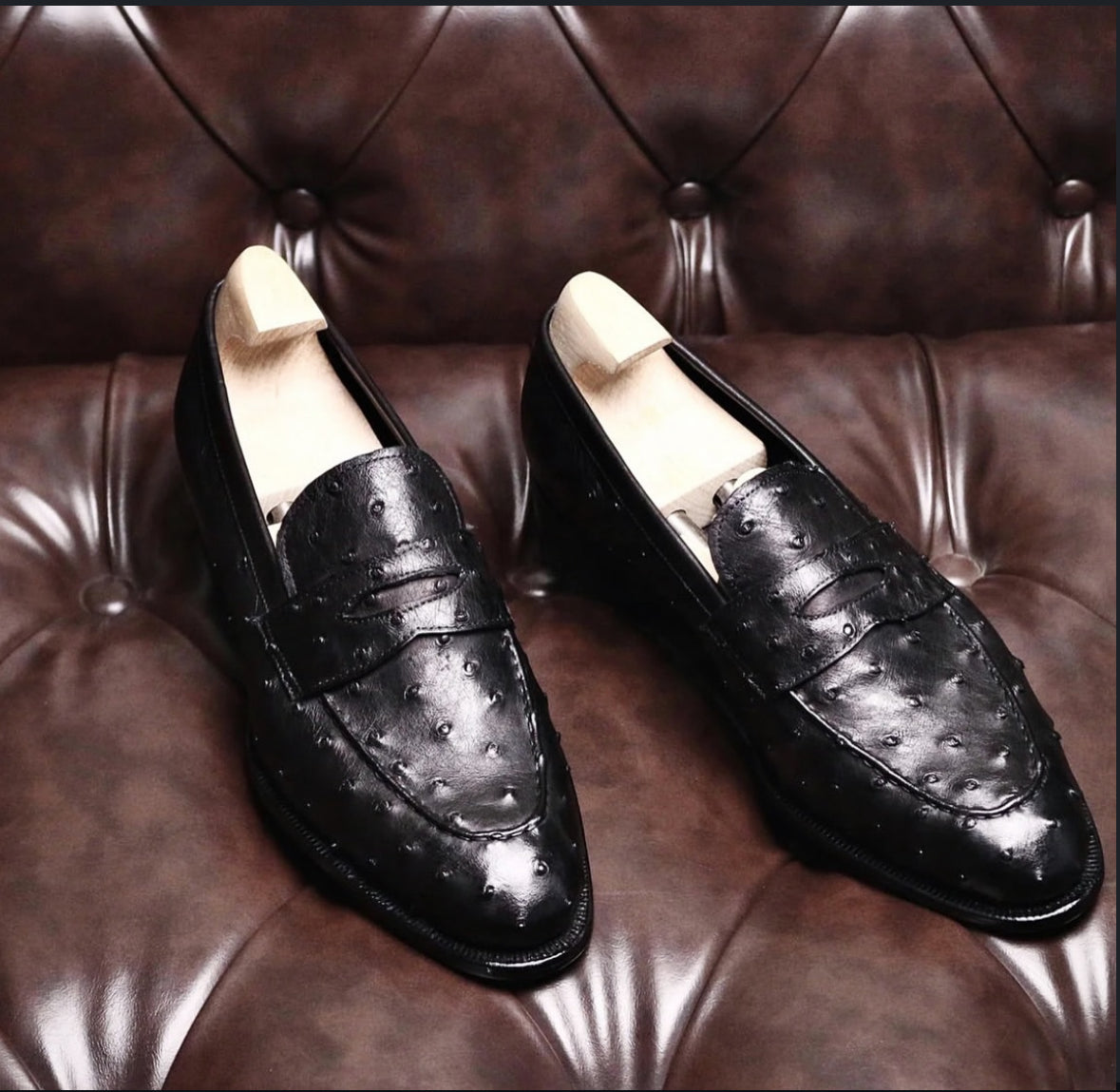 Black ostrich skin penny loafers