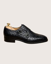 Man wearing a dark brown ostrich skin wholecut oxford with a navy suit
