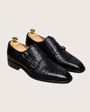 Toe of dark brown ostrich oxford showing crown hide quill placement