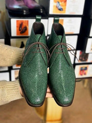 Pearl running along the vamp of a men's green stingray derby boot