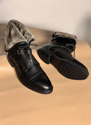 Side profile of a black leather boot on a Goodyear welted sole
